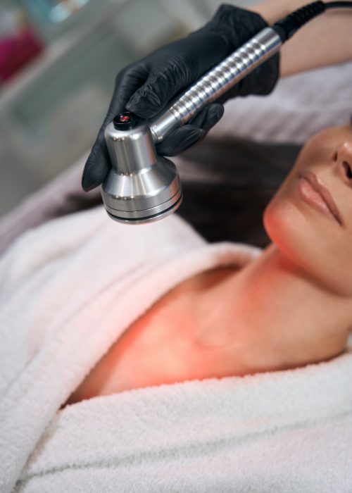 Female doing body skin rejuvenation, working in salon